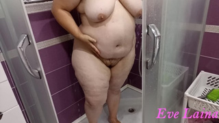 Older, curvy milf with a massive, cellulite booty and monstrous boobies takes a shower.